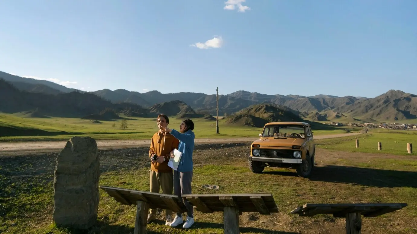 A long shot of people on a road trip.